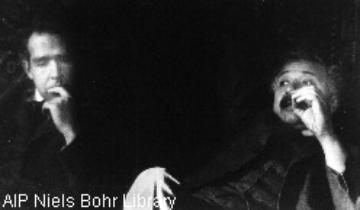 Bohr and  Einstein who were engaged in a famous debate on physical reality and the completeness of quantum theory